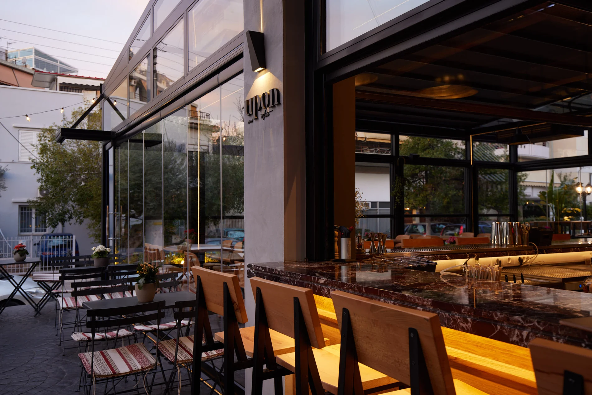 Warm lighting and open terrace at UPON